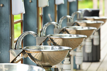 Image showing sinks and taps in outdoor