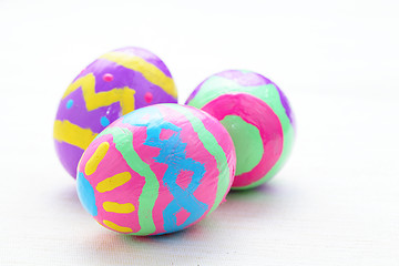 Image showing children paint colorful easter eggs