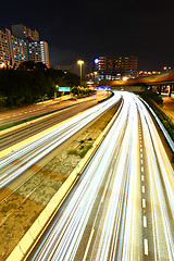 Image showing light trail in city at night