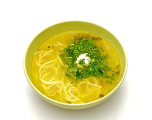 Image showing Bowl homemade chicken noodle soup with greens and sour cream