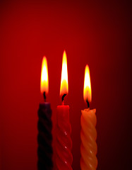 Image showing Three Candles On Red