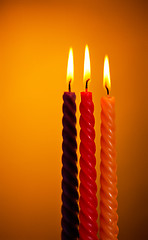 Image showing Three Candles On Yellow