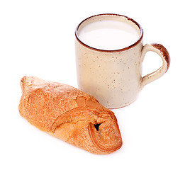 Image showing Crispy Bun and Mug of Milk