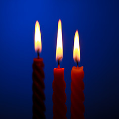 Image showing Three Candles On Blue