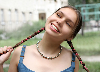 Image showing Girl with braids smiling