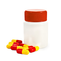 Image showing Capsule red and yellow with a jar