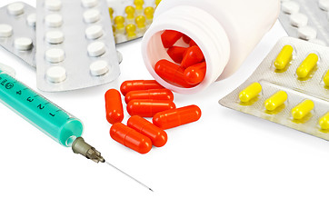 Image showing Capsule red with drugs and a syringe