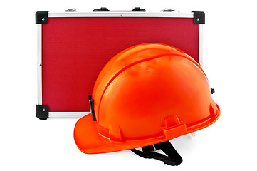 Image showing Orange helmet and red suitcase