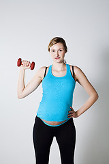 Image showing Pregnant woman exercising with dumbbells