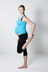 Image showing Pregnant woman stretching