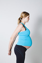 Image showing Pregnant woman stretching