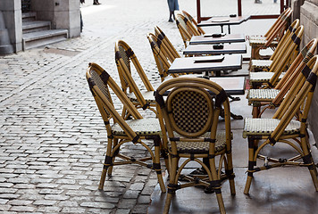 Image showing Empty cafe tables in Brussels cobbled square