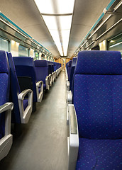 Image showing Empty railway carriage with blue seats