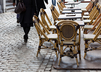 Image showing Empty cafe tables in Brussels cobbled square