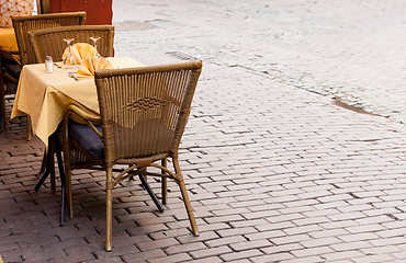 Image showing Empty cafe tables in Brussels cobbled square