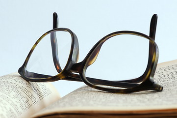 Image showing Open book and eyeglasses