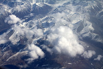 Image showing  Pattern of snow, clouds and stones: view from height.