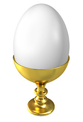 Image showing Boiled egg in golden cup isolated on white background.