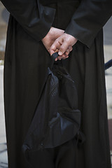 Image showing Priest with rucksack