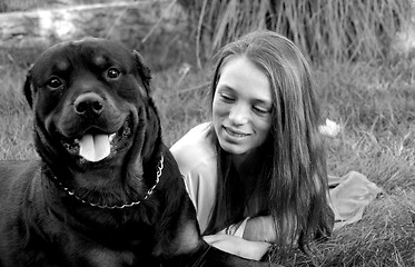 Image showing girl and rottweiler