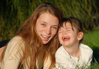 Image showing two laughing sisters