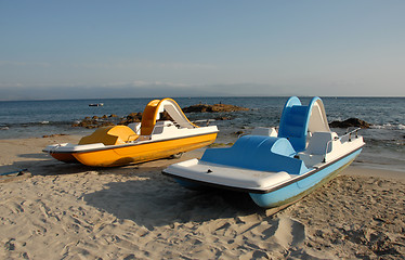 Image showing blue and yellow pedalos