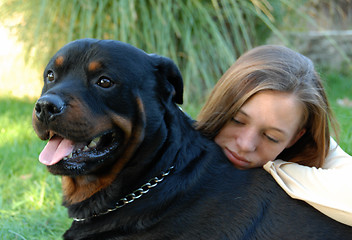 Image showing girl and rottweiler