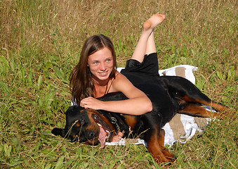 Image showing girl and rottweiler