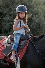 Image showing baby riding girl