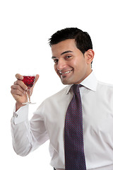 Image showing Man raising a glass of wine