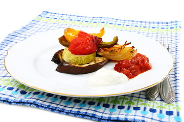 Image showing Roasted vegetables with yogurt and tomato sauces.