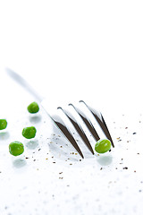 Image showing Close-up of fork and peas