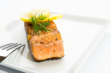 Image showing Delicious grilled salmon on a white plate