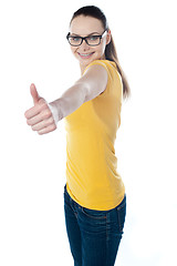 Image showing Glamourous teenager gesturing thumbs-up
