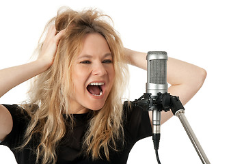 Image showing Rock singer screaming to the microphone