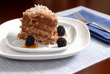 Image showing A slice of German Chocolate cake with blackberries