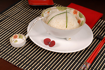 Image showing Bowl of rice with chives in antique Asian bowl