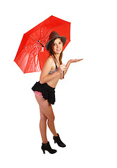 Image showing Young girl with red umbrella.