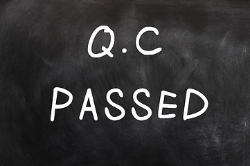 Image showing QC passed written on a chalkboard 