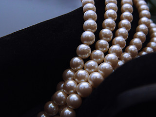 Image showing Closeup Pearls and Suede