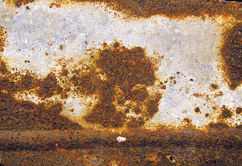 Image showing Background of ancient cracked rusty tin wall. 