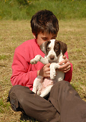 Image showing child and puppy