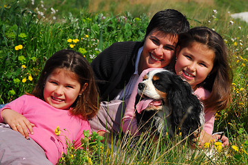 Image showing family and dog