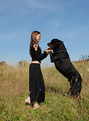 Image showing girl and rottweiler