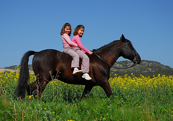 Image showing riding twins 