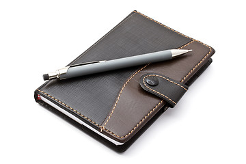 Image showing Black notebook and Mechanical pencil 