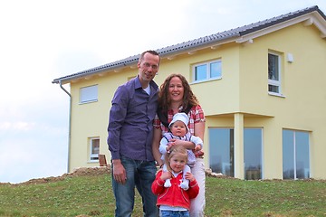 Image showing Family in front of her house