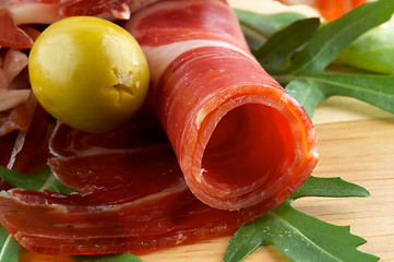 Image showing Slices of jamon and olives