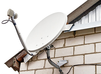 Image showing Satellite dish antenna on house