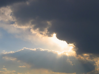 Image showing rain cloud and rays of sunlight